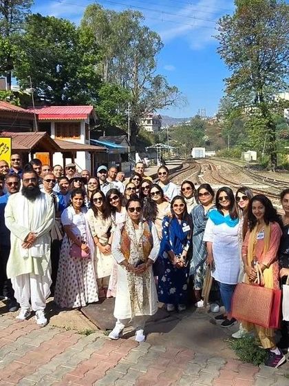 Our group at the Dharampur railway station in Himachal, a part of our local excursions. We ensure our retreats include exploring the unique character of each sacred location.