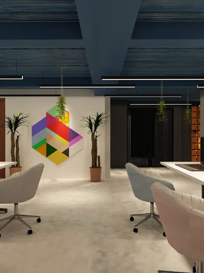 The workstation area is designed to be free of distractions, with simple furniture and ample natural light. The colorful geometric art piece adds a touch of creativity to the minimalist space.