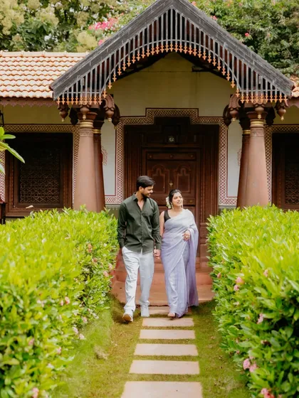 A quiet moment on a rocking chair at a heritage resort. This setting is perfect for capturing a relaxed and timeless pre-wedding photo, surrounded by greenery.