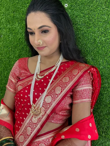 The bride looking down, showcasing the beautiful eyeshadow work.