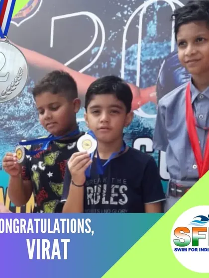 Virat proudly holding his silver medal. We celebrate every swimmer's success, big or small.
