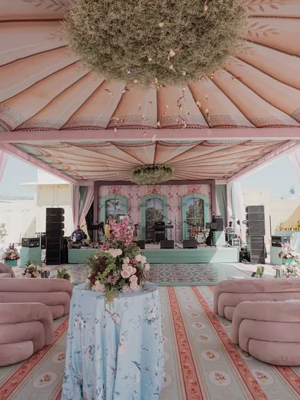 My work also embraces softer, romantic narratives. This 'Mint to Be' event showcases a fairytale garden aesthetic, with a custom-printed pastel canopy, plush pink seating, and a stage that feels both whimsical and elegant.
