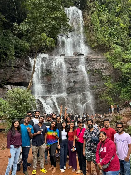 A large, cheerful group photo in front of Hebbe falls, showing the scale of our weekend trips.