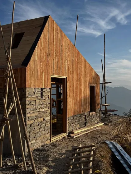 The combination of a solid stone base and a lighter timber-clad upper level is a recurring theme in our mountain architecture. This approach grounds the building firmly in the earth while allowing for warmth and light in the living spaces.