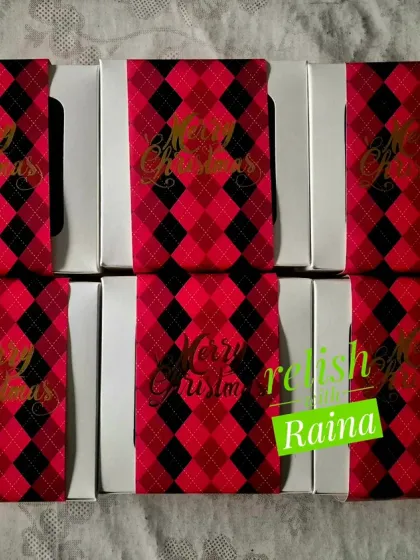 Six loaf-style Christmas fruit cakes packed in elegant red and black sleeves. These are easy to slice and share during holiday gatherings.