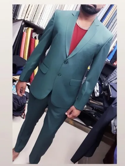 This client chose a unique teal green fabric for his two piece suit. At my shop, you can select from many unconventional colors to create a truly one of a kind formal suit.