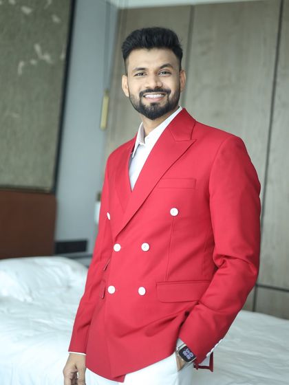 A vibrant red double-breasted blazer makes an undeniable impact. We designed this for a client's special event, ensuring he would stand out with confidence and style.