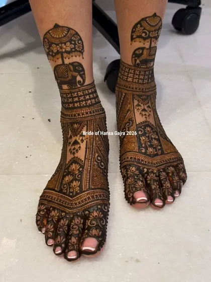 A bride's look is complete only when her feet are adorned with beautiful henna. I designed this piece with royal elephants and intricate lotus panels to create a grand, traditional statement for her special day.