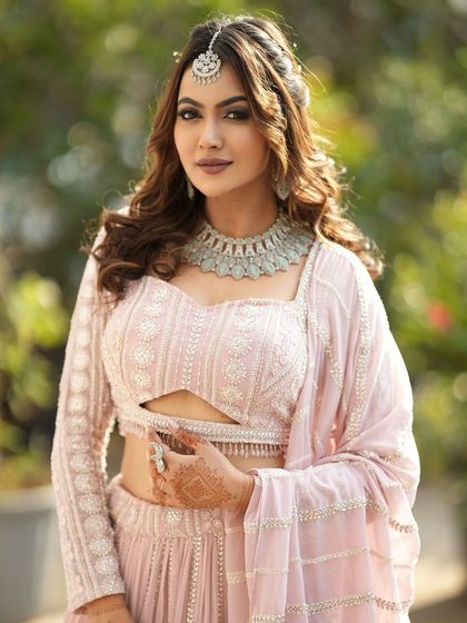 A confident pose from a client wearing our silver-finish rental set. It's the perfect accessory for a modern ethnic outfit.