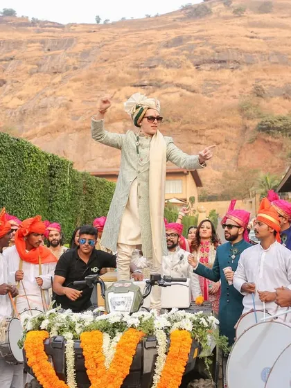 The groom's grand entrance on a tractor, full of energy and dhol beats. The baraat is a party, and I make sure to capture every bit of that excitement.