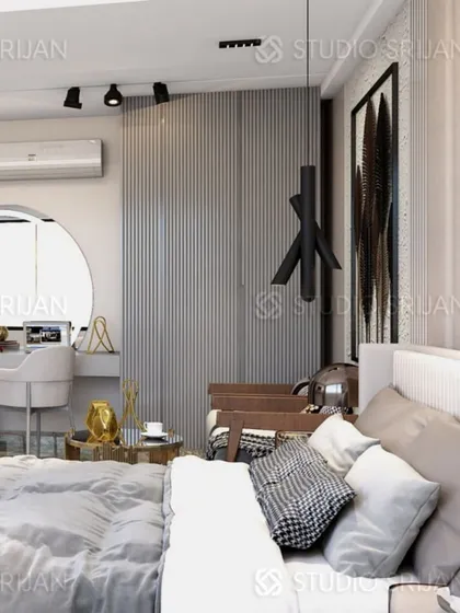 This close-up shows the cozy corner of the bedroom, with a vanity desk set in an arched nook and a modern, sculptural pendant light.