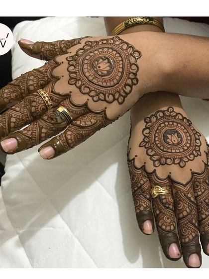 A back-hand mandala design for the Vat Savitri festival, featuring a small elephant motif.