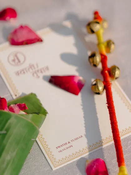 Another look at the personalized stationery, showing the couple's monogram and event details.