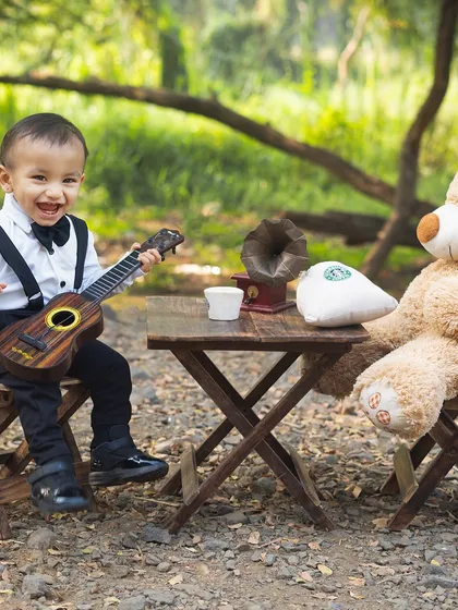 A joyful serenade for his furry friend. This candid shot is full of personality and charm.