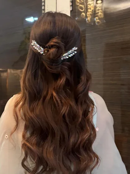 Another angle of the beautiful half-up style, showing the texture of the waves and the shine of the hair.