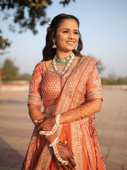 A full shot of her engagement look, capturing the golden hour glow that makes her skin look absolutely radiant.