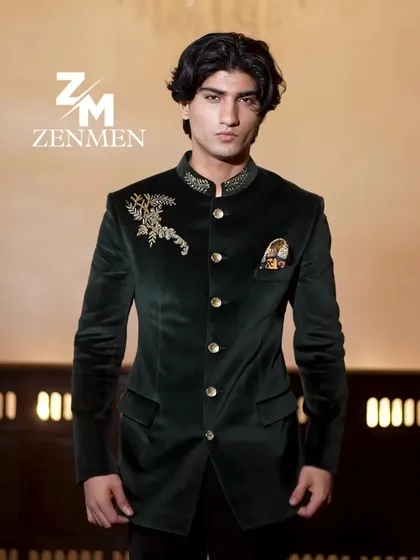 An emerald green velvet bandhgala with delicate gold embroidery on the shoulder and a custom pocket square. A perfect outfit for a reception event.