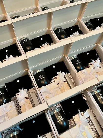 I handle corporate gifting at any scale. Here’s a look at a bulk order of beautifully packaged hampers for BizDateUp, each containing a branded tumbler and other curated items for their team.