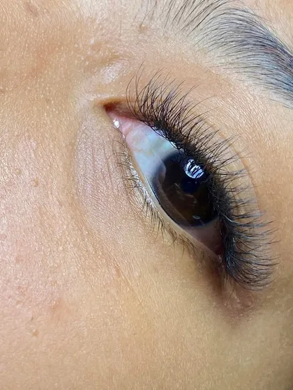 From this angle, you can appreciate the beautiful curl and length of the extensions. I carefully select the right type of lash to create a gentle, upward curve that opens up the eye area.