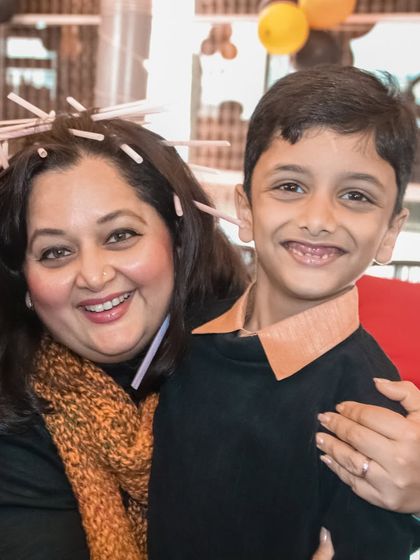 A fun and playful portrait of a mother and son, showing their happy and loving relationship.