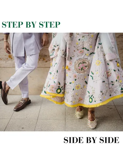 "Step by step, side by side." A creative shot focusing on the couple's coordinated footwear and the beautiful embroidery of the bride's lehenga.