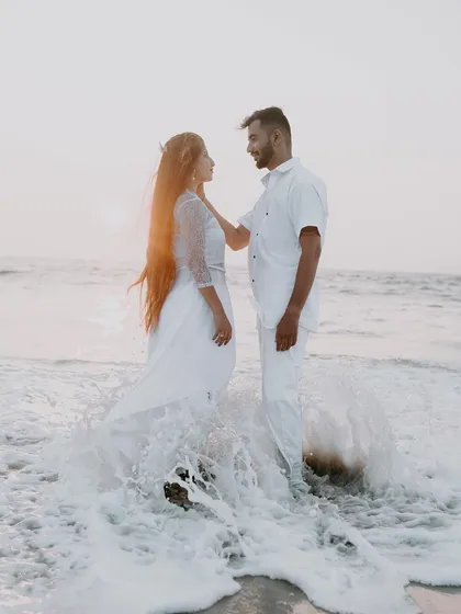 A beautiful moment captured in the ocean surf. We love using natural elements like water and light to create dynamic and romantic pre-wedding beach photos.
