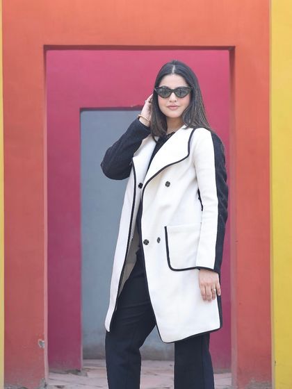 A fashion portrait taken at our popular colorful wall set. The geometric, multi-hued backdrop makes any outfit pop, perfect for brand photoshoots.