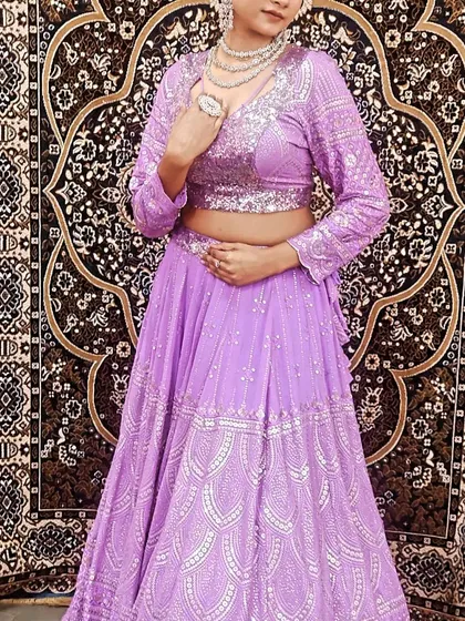 A full-length view of the lavender lehenga with silver embroidery. This is a great option for a bridesmaid or for a Sangeet performance.
