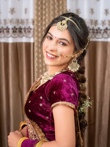A happy smile from a model after a student created this beautiful velvet lehenga look. Capturing these moments is part of the portfolio shoot.