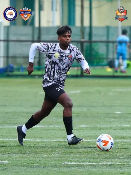 Our player driving forward with the ball, embodying the relentless attacking spirit of our team.