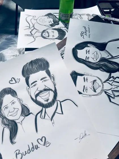 Another view of some finished couple portraits, highlighting the bold line work.
