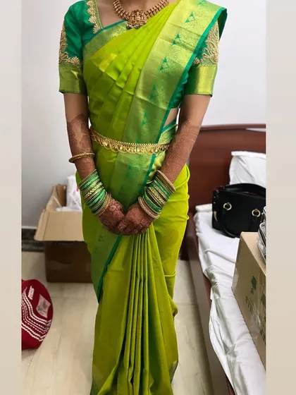 Another example of my saree draping. This vibrant green Kanchipuram silk is draped to perfection, showcasing the beauty of the saree.