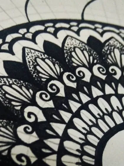 Another in-progress shot, showing the outer layers of a mandala being drawn. It's a slow and steady process of filling in each section, which is what makes it so meditative.