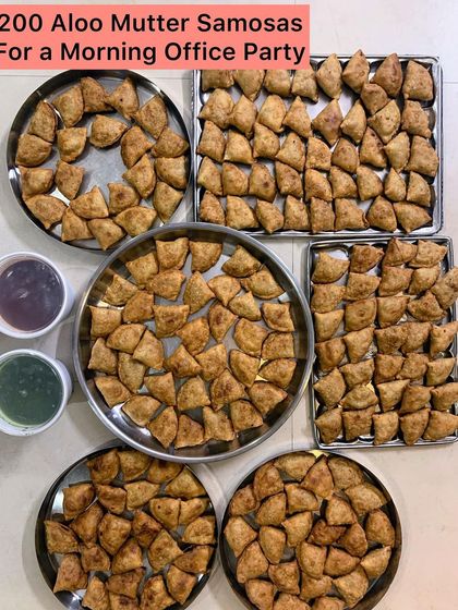 Trays filled with 200 crispy Aloo Mutter Samosas.