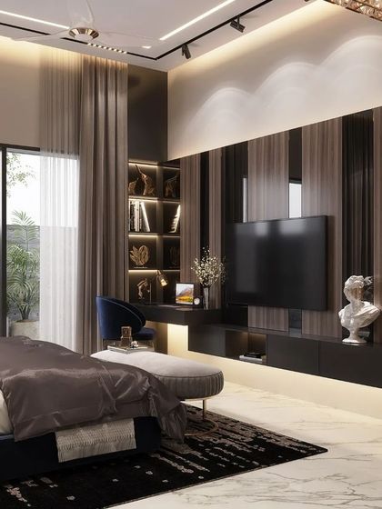 This luxury bedroom in Rohtak features a sophisticated TV and study unit built into a wood-paneled wall. The design combines functionality with high-end aesthetics, using integrated lighting to highlight books and decor items.