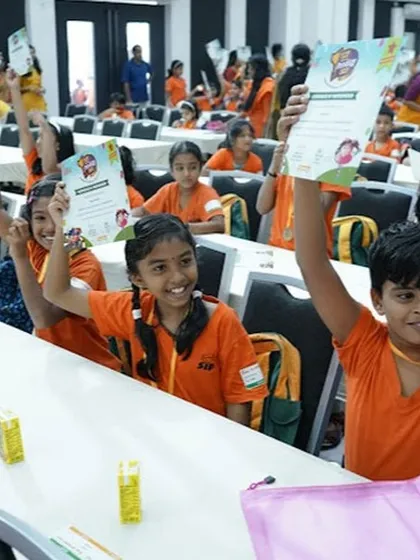 Our students are all smiles, holding up their certificates after a competition. Their achievements are a source of great pride for our entire center.