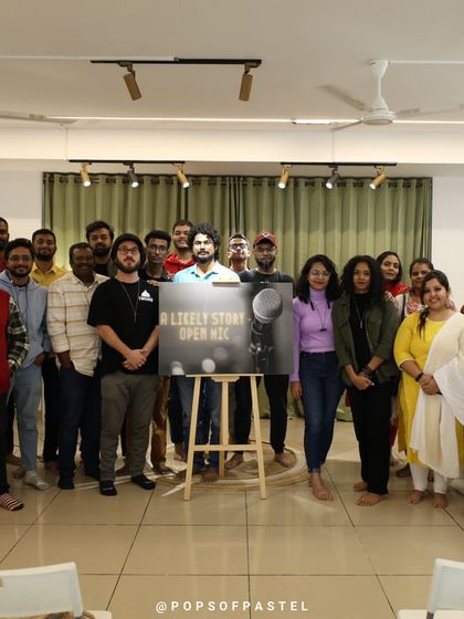 The whole crew from "A Likely Story" open mic gathers for a group photo.