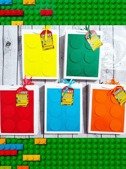 The handmade paper bags are designed to look like giant building blocks and come in various bright colors.