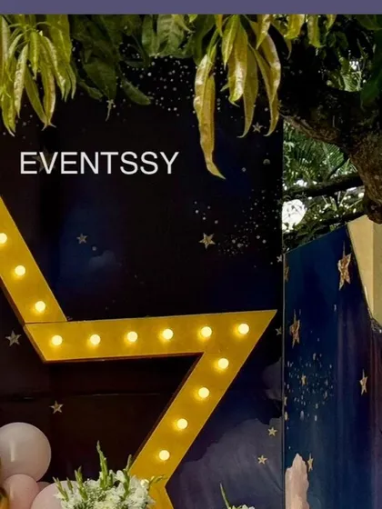 A close-up of the large marquee star light, a key element of the "Twinkle Twinkle Little Star" theme.