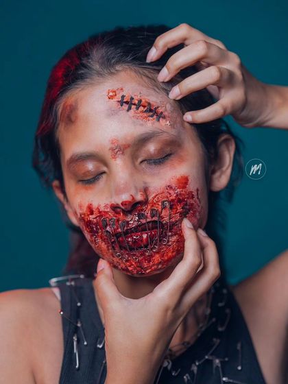 A close-up of the SFX work, showing the texture of the fake wounds and blood.