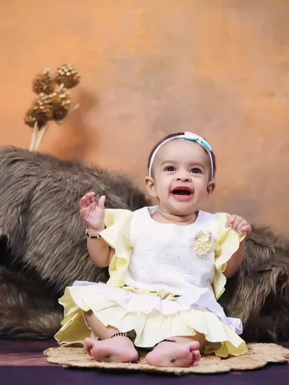 A big, happy laugh from the baby girl during her rustic princess-themed shoot.