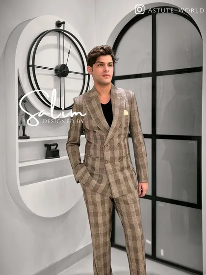 A full-length view of the client in the plaid double-breasted suit. It's a sophisticated look that works for both formal and smart-casual settings.