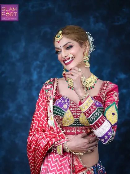 This look is all about celebrating tradition with a modern twist. The makeup is flawless, and the colourful outfit is perfect for the festive season.