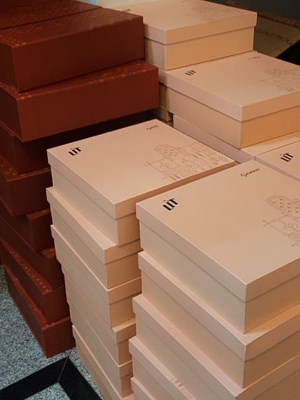 Piles of custom-designed boxes for our corporate clients during Diwali. We handle bulk orders with the same personal touch and attention to detail.