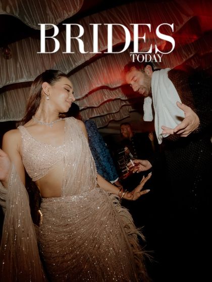 The energy of the dance floor, featured in Brides Today. This candid shot captures the couple lost in the rhythm of their celebration, showcasing the fun and dynamic atmosphere of their wedding night.
