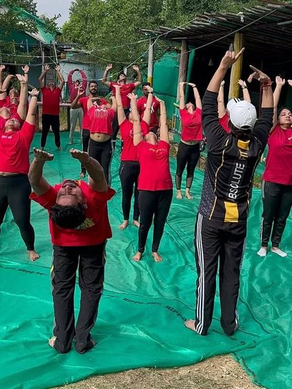 Guiding a corporate retreat group in an outdoor setting. A wellness retreat is a fantastic way for teams to disconnect from stress and reconnect with themselves and each other.