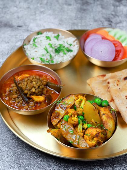 Some days, cooking isn't an option. That's when our fresh, balanced veg thali with aloo gobi and dal comes to the rescue.