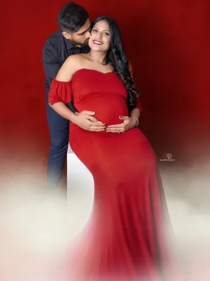 Another beautiful take on the red gown theme. This seated pose creates an elegant silhouette, with a soft, dreamy effect to highlight the couple's romance.