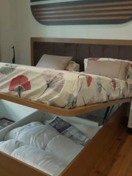 We believe bedrooms should be sanctuaries of calm and clever storage. This modular bed features a veneer finish and a powerful gas-pump lift-up mechanism, revealing a huge, easily accessible storage space for linens and more.