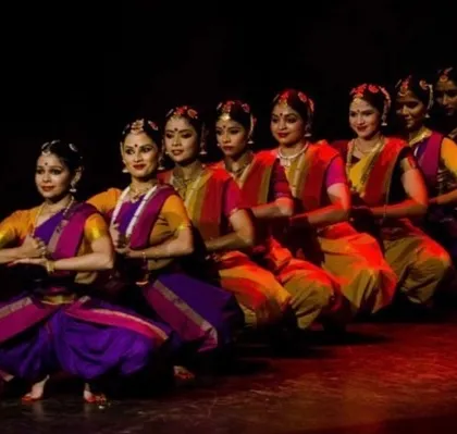 A line of my Bharatanatyam dancers in a moment of perfect synchronicity. This image showcases the precision and grace that forms the foundation of our classical dance segments.